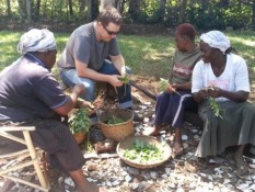 Ashley discussing ideas for making their food go further with farmers in Kisumu