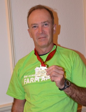 Managing Director of SABMiller South Africa, Mark Bowman with his medal after running the Virgin London Marathon to raise funds for Farm Africa