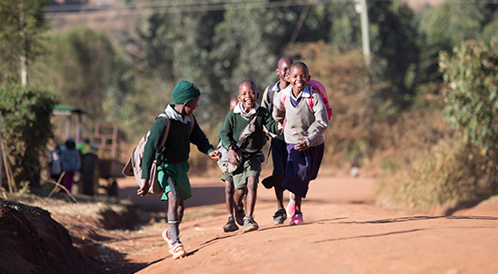 Children running up path - Chili project
