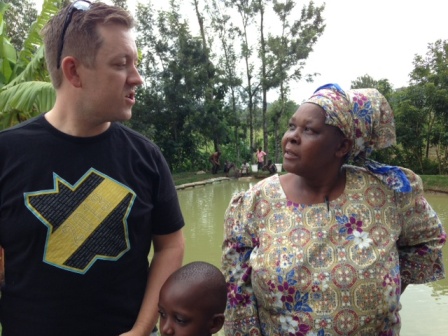 Ashley talks to Joyce in front of her pond after a joyous reunion one year after the chef originally visited Farm Africa's aqua shops project.