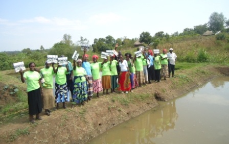 Afula women receive their photobooks from Dig for Good. 