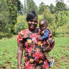 A female farmer with her baby in western Kenya.