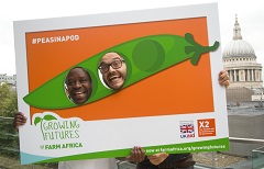 Dennis Mwakulua and Danny Everett with the Farm Africa Growing Futures Peas in a Pod selfie frame