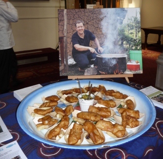 Farm Africa canapes served in front of a picture of leading UK chef, Ashley Palmer-Watts, who last year travelled to Farm Africa's Aqua Shops project in Kisumu, Western Kenya.