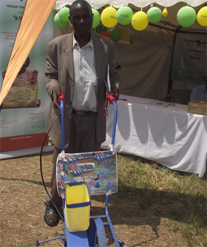 Stephen with a rice planting machine